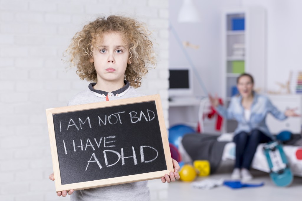 Kid holding a ADHD sign